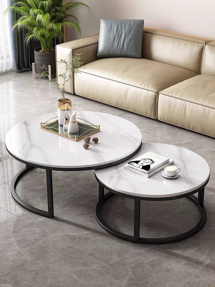 a living room with two tables 